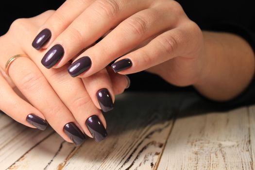 glamorous beautiful manicure on a trendy texture