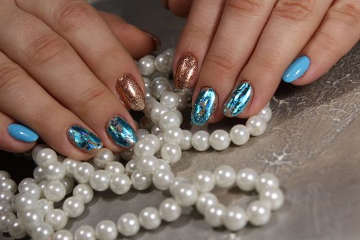 The refined beautiful female fingers with original design manicure