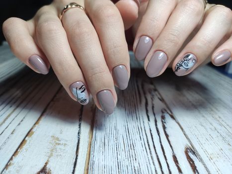 Autumn manicure. Beautyful nails design with autumn leaves. Top view. cozy autumn image.