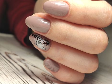 Autumn manicure. Beautyful nails design with autumn leaves. Top view. cozy autumn image.