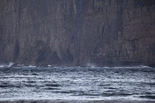 Landscape showing sea waves crushing against the cliff, Faroe Islands