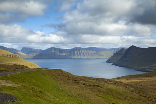 Panoramic view of spectacular Faroese fjords near Funningur as seen from a high mountain next to Slaettaratindur during a sunny autumn day