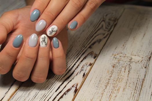 fashion manicure with a design on a beautiful texture