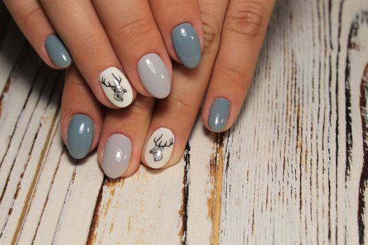 fashion manicure with a design on a beautiful texture