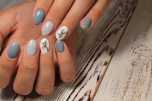 fashion manicure with a design on a beautiful texture