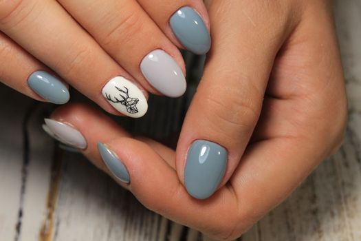 fashion manicure with a design on a beautiful texture