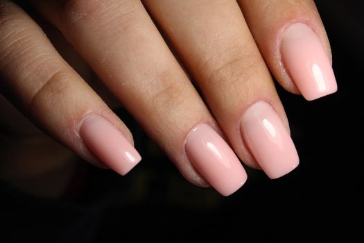 beautiful French manicure on a trendy texture background