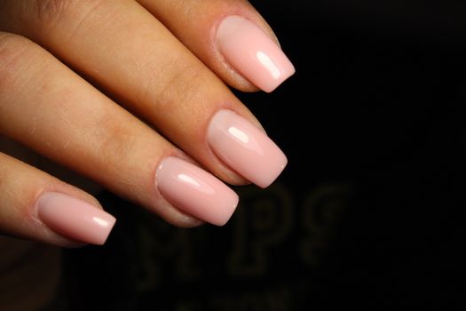 Sexual pink manicure on beautiful female hands