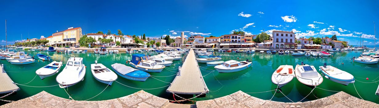 Krk. Town of Malinska harbor and turquoise waterfront panoramic view, Krk island in Croatia