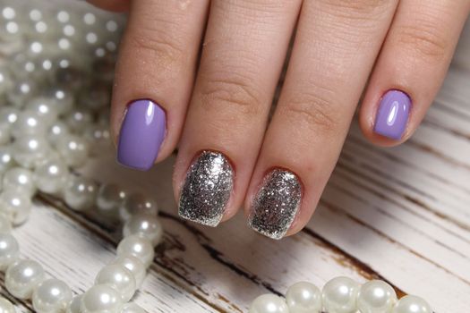 sexy gray manicure on a trendy texture background