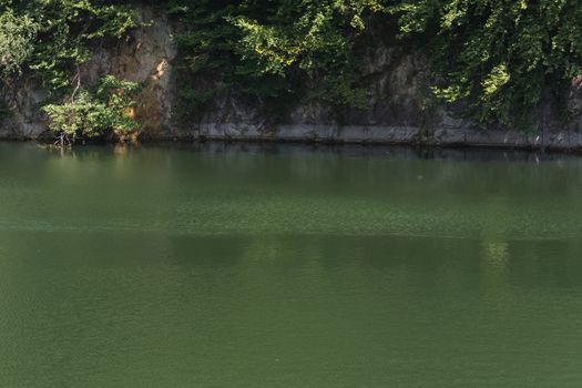 Lake with banks on the site of a former quarry for the extraction of limestone