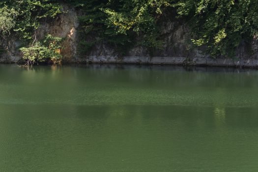 Lake with banks on the site of a former quarry for the extraction of limestone