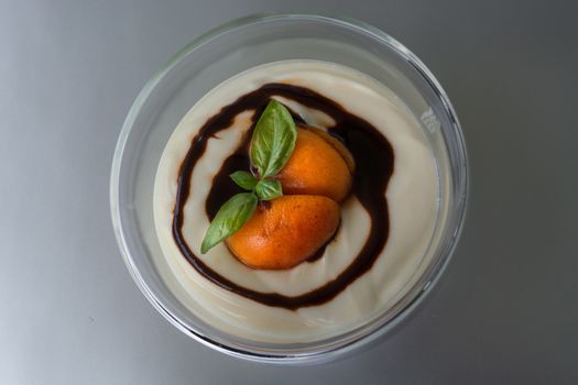 Dessert in glass bowl filled with a fruity pudding.