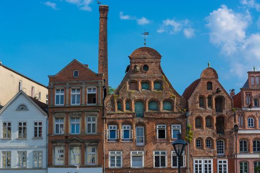 Half-timbered red brick houses near the river on the old harbor Lueneburg, Germany