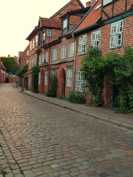 Half-timbered red brick houses near the river on the old harbor Lueneburg, Germany