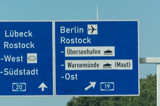 Autobahn sign in Germany Caption on German - city names Berlin,Berlin Airport, Rostock, Lübeck
