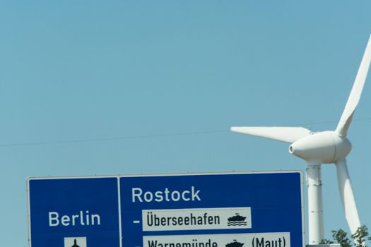 Autobahn sign in Germany Caption on German - city names Berlin,Berlin Airport, Rostock, Lübeck