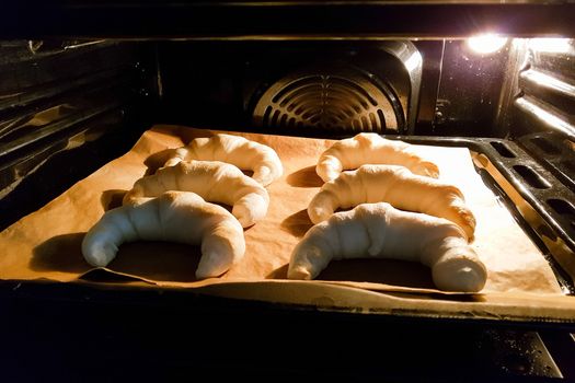 Homemade pastries, croissants in the oven. 