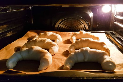 Homemade pastries, croissants in the oven. 