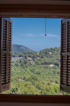 Landscape Houses and mountains seen through the window.