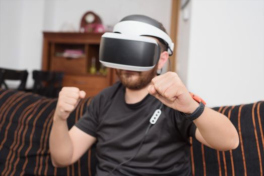 Bearded man wearing virtual reality goggles