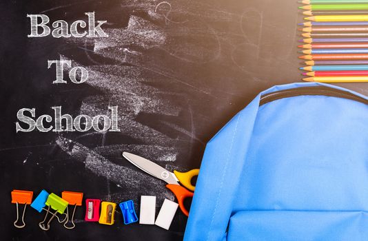 Back to school shopping backpack, The Accessories in student blue bag on blackboard background and have chalkboard also