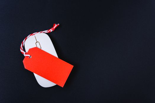 Online shopping Blank red tag on white mouse with black background