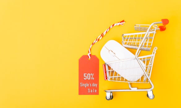 Online shopping Single's day sale text on red tag label have white mouse on cart shopping, with copy space on yellow background