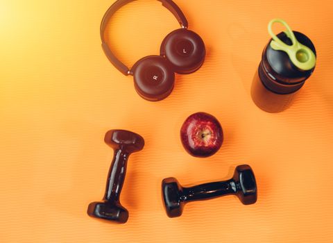 dumbbell, headphones equipment for workout exercise at fitness gym
