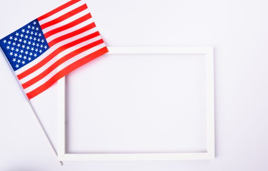 Martin luther king day, flat lay top view, American flag and photo frame on white background with copy space for your text