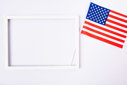 Martin luther king day, flat lay top view, American flag and photo frame on white background with copy space for your text
