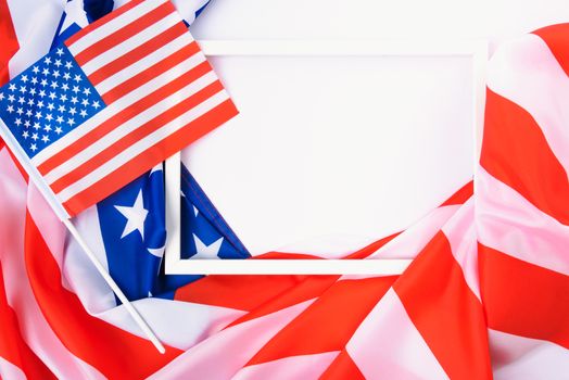 Martin luther king day, flat lay top view, American flag and photo frame on white background with copy space for your text