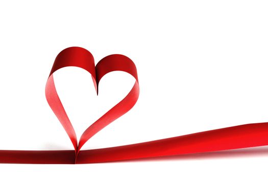 Heart shaped red ribbon isolated on white background