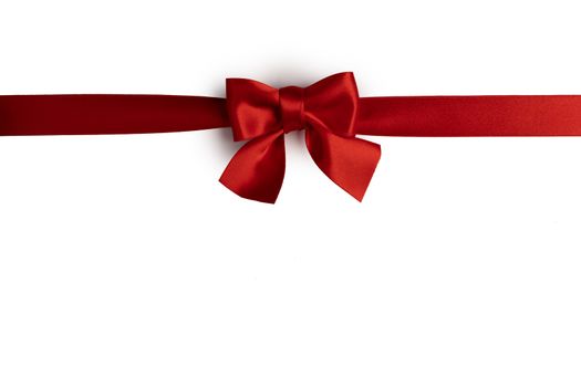 Elegant satin red ribbon bow isolated on white background