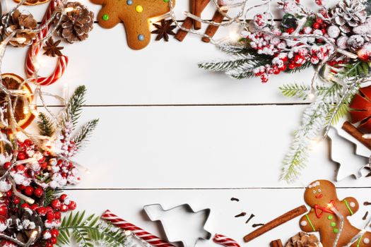 Christmas flat lay background with traditional gingerbread cookies dried orange cinnamon on wood , copy space for text