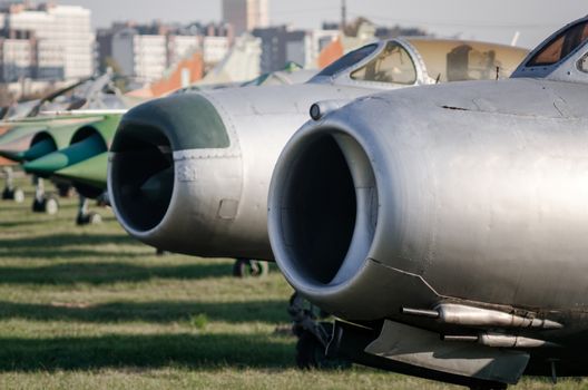 exhibition museum of the old army combat fighter aircraft against the background of the city