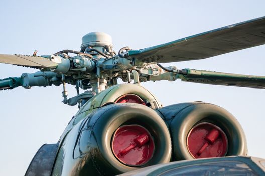 engine with helicopter propeller blades isolated on blue sky background close up