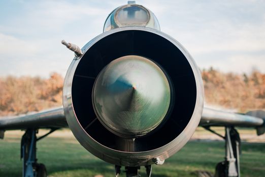 old army military combat fighter plane against sky and clouds close up