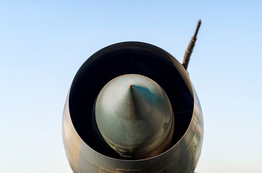 turbine old army military combat fighter aircraft isolated on blue sky background