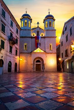 Illuminated Church of Saint Nicholas in Old Town of Kotor at sunrise, Montenegro