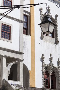Palacio Nacional de Sintra exterior close-up with windows, doors and a lantern