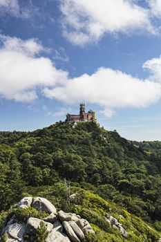 View of Palacio da Pena on the top of the mountain from Castelo dos Mouros