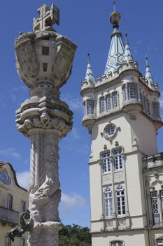 Sculpture outside Sintra Town Hall baroque building on a sunny day with blue sky.