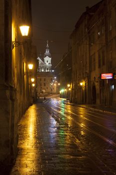 Ruska street by night with the Carmelite Church on the background, Lviv, Ukraine