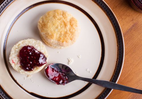 Fresh homemade traditional English scones in a plate ready for the four o'clock tea snack