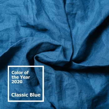 Abstract textured background made of classic blue 2020 color. Color of year 2020 linen textile backdrop. COY2020 concept. Copy space for text