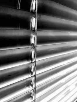 aluminium louver shutter monochrome background. closed sunblinds texture