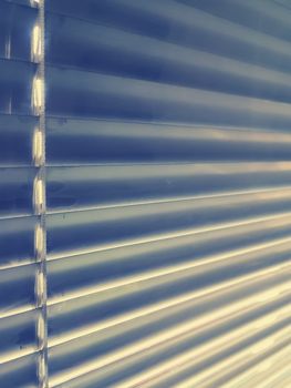 Sunblinds Silver aluminum louver on window horizontal pattern. Shutters On glass In The Office or home  interior