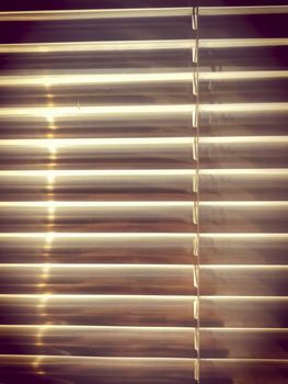 Aluminum Louver or glass shutter closed on window. Vintage color style background.