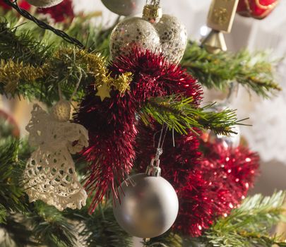 Christmas ornaments on a pine tree background. decorations on evergreen tree branch